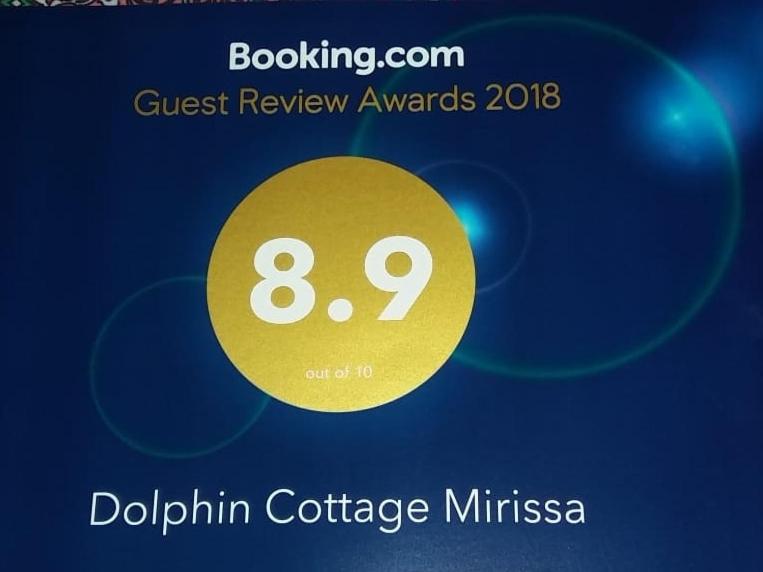 米瑞莎Dolphin Cottage Mirissa的黄色圆圈评奖标牌