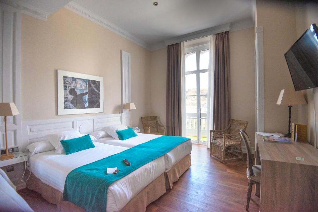 罗萨里奥别墅酒店客房内的一张或多张床位