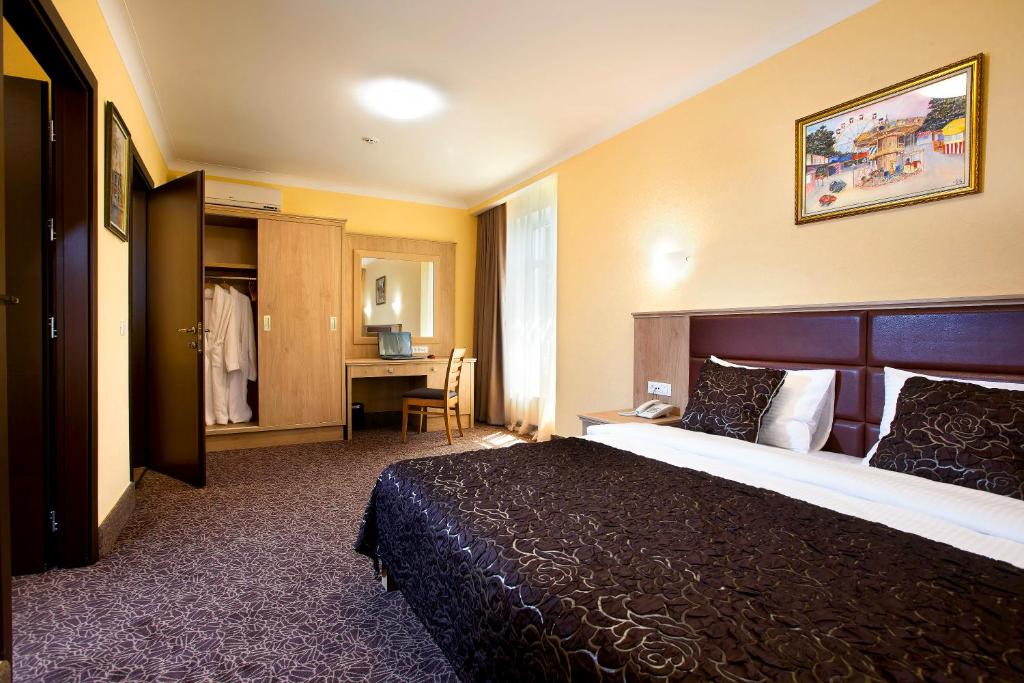 GRAND OTRADA Hotel Resort & SPA客房内的一张或多张床位