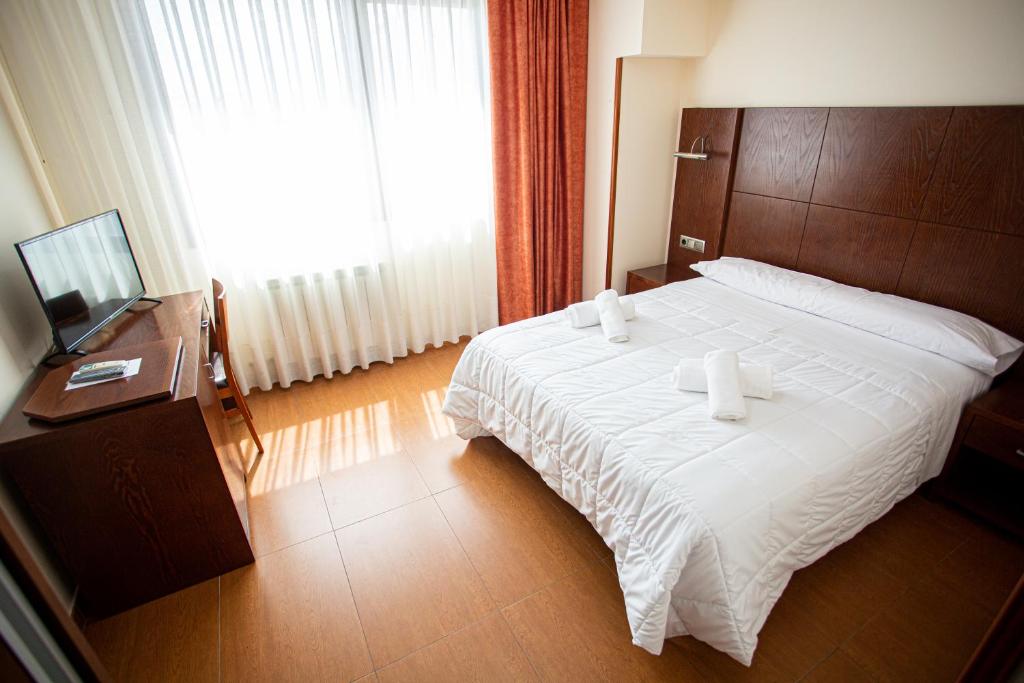 Hotel Villa De Cárcar客房内的一张或多张床位