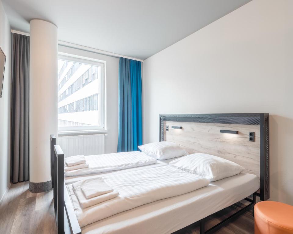 科隆诺伊马克特A&O经济型连锁酒店客房内的一张或多张床位