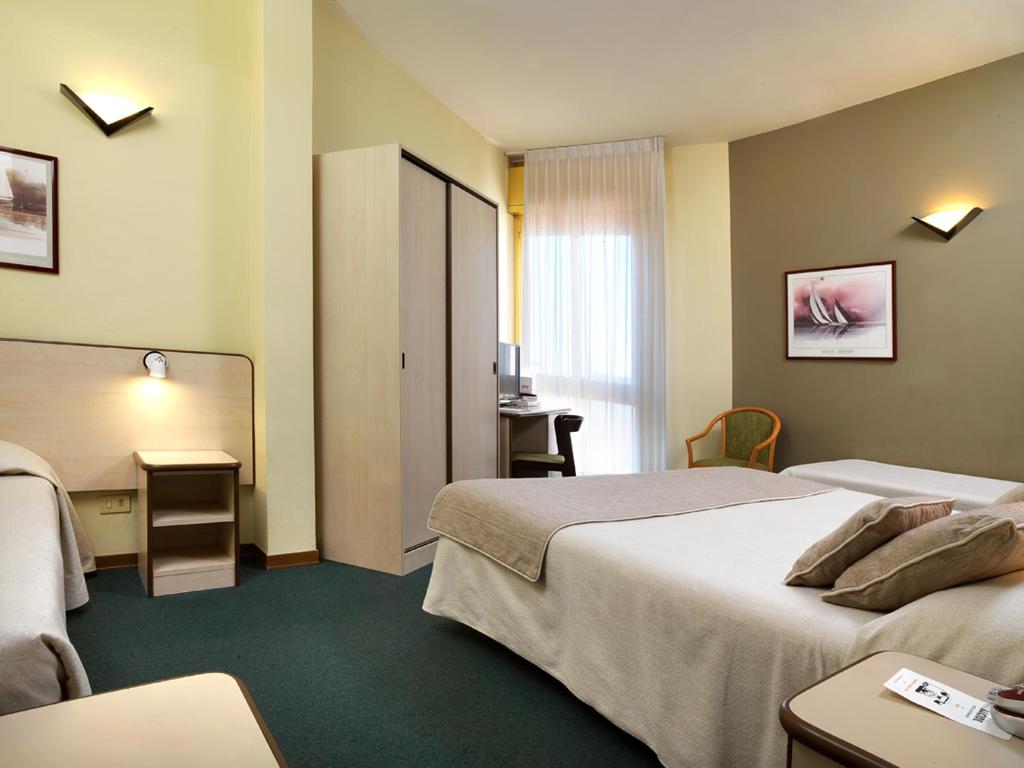 Hotel Ristorante Alcide客房内的一张或多张床位