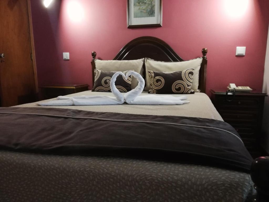 Hotel Termas客房内的一张或多张床位