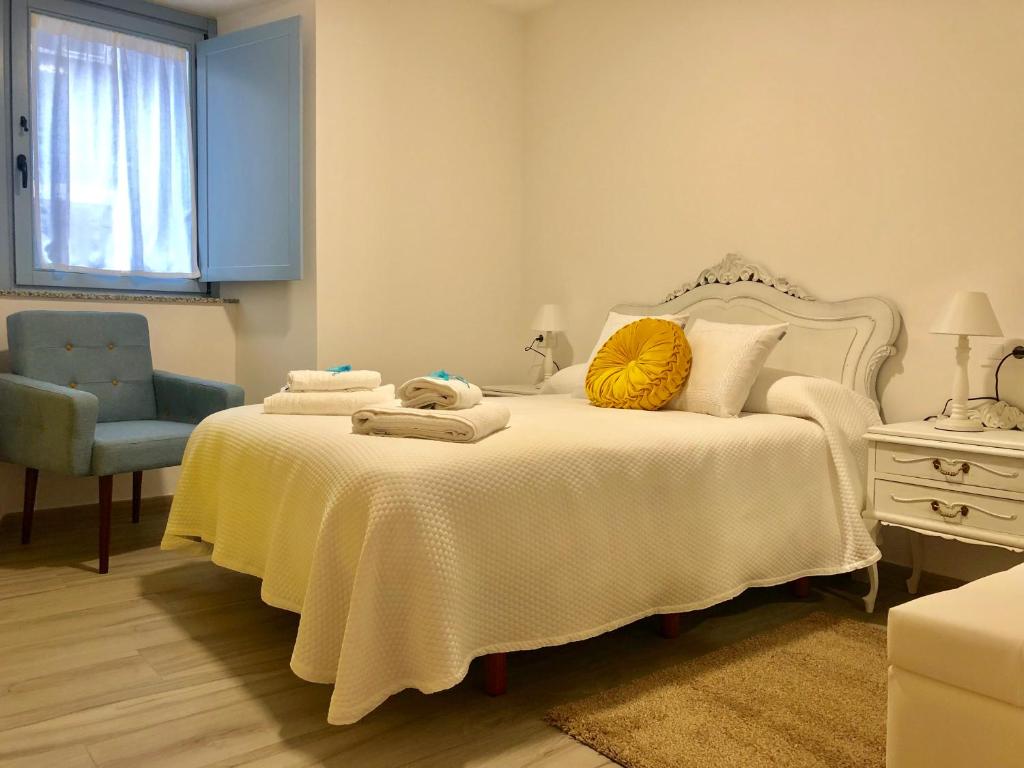 Apartamentos Turísticos Casa Dina客房内的一张或多张床位