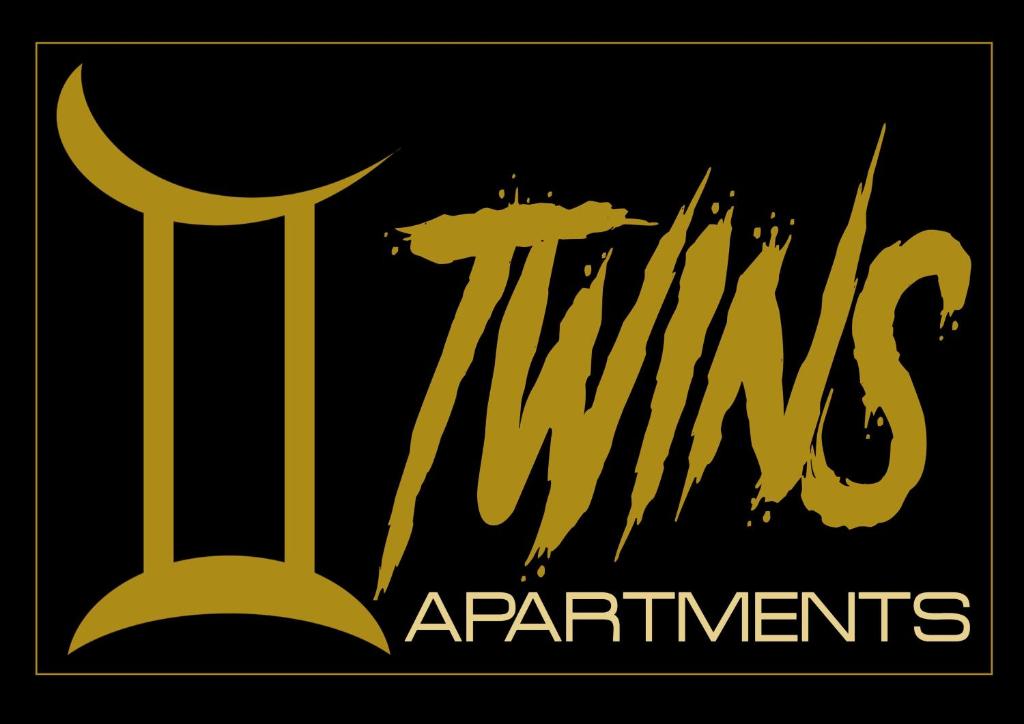 下皮尔戈斯Twins Apartments的带有向导的金色标志