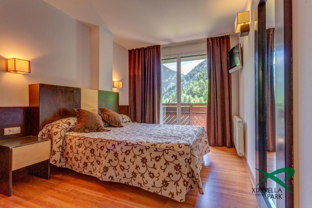Apartamentos Xixerella Park Resort客房内的一张或多张床位