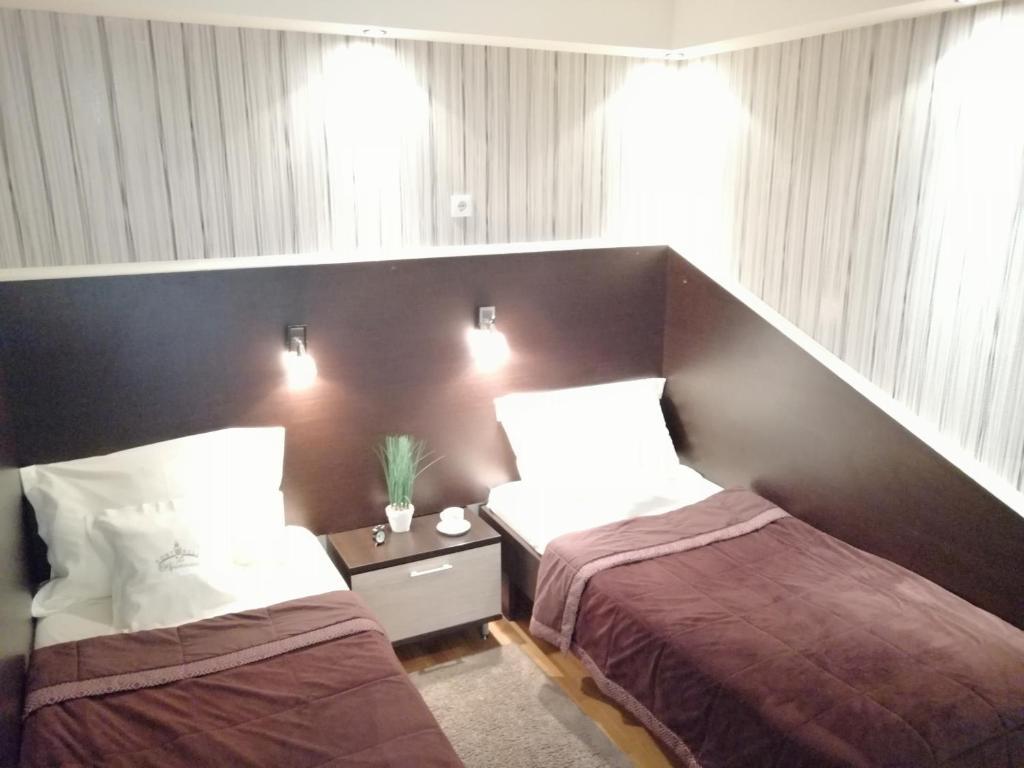 丰泽公寓式酒店客房内的一张或多张床位