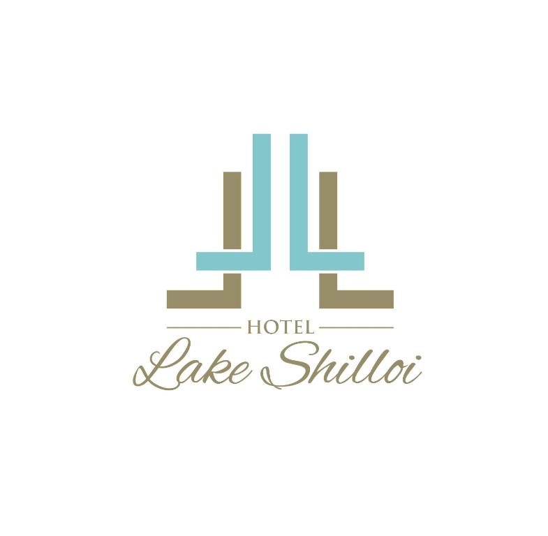 迪马普尔Hotel Lake Shilloi的湖区标志