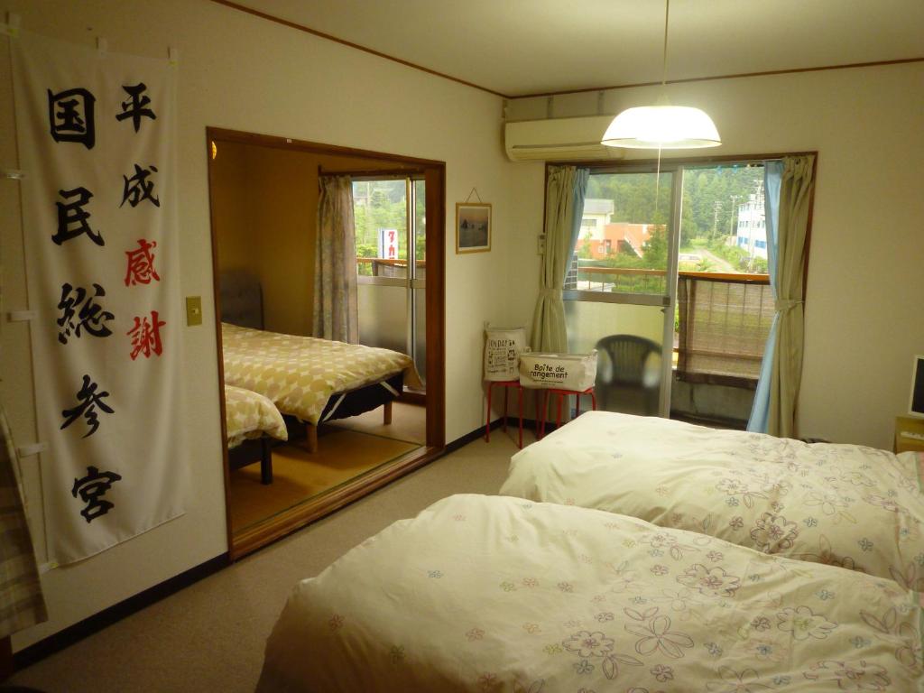 Futami Terrace B客房内的一张或多张床位