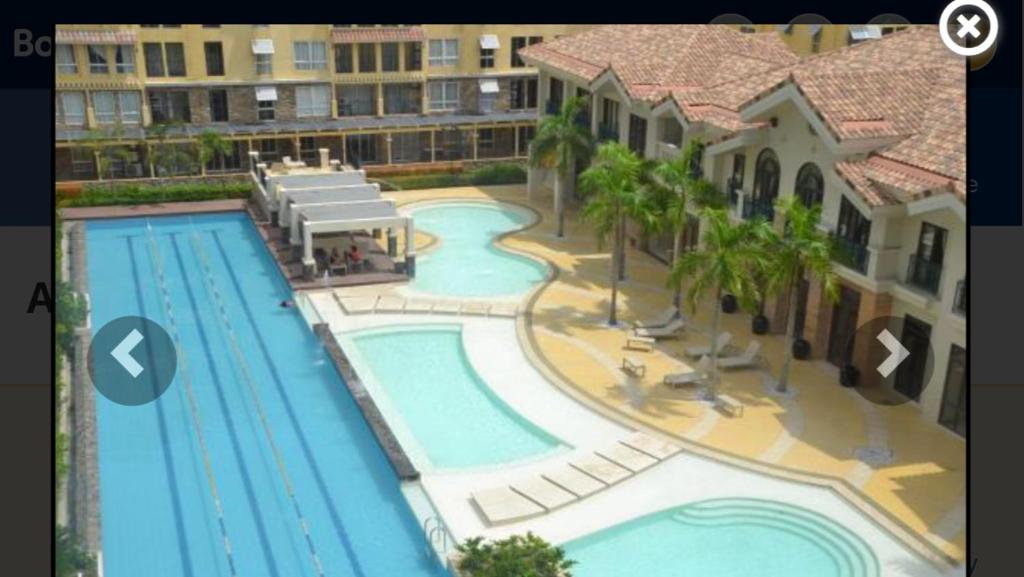 宿务阿马尔菲绿洲公寓的度假村游泳池的图片