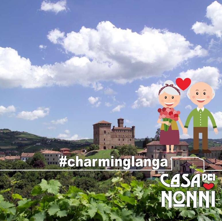 格林扎内卡武尔Casa dei Nonni #charminglanga的一副站在葡萄园顶上的一对夫妇的照片