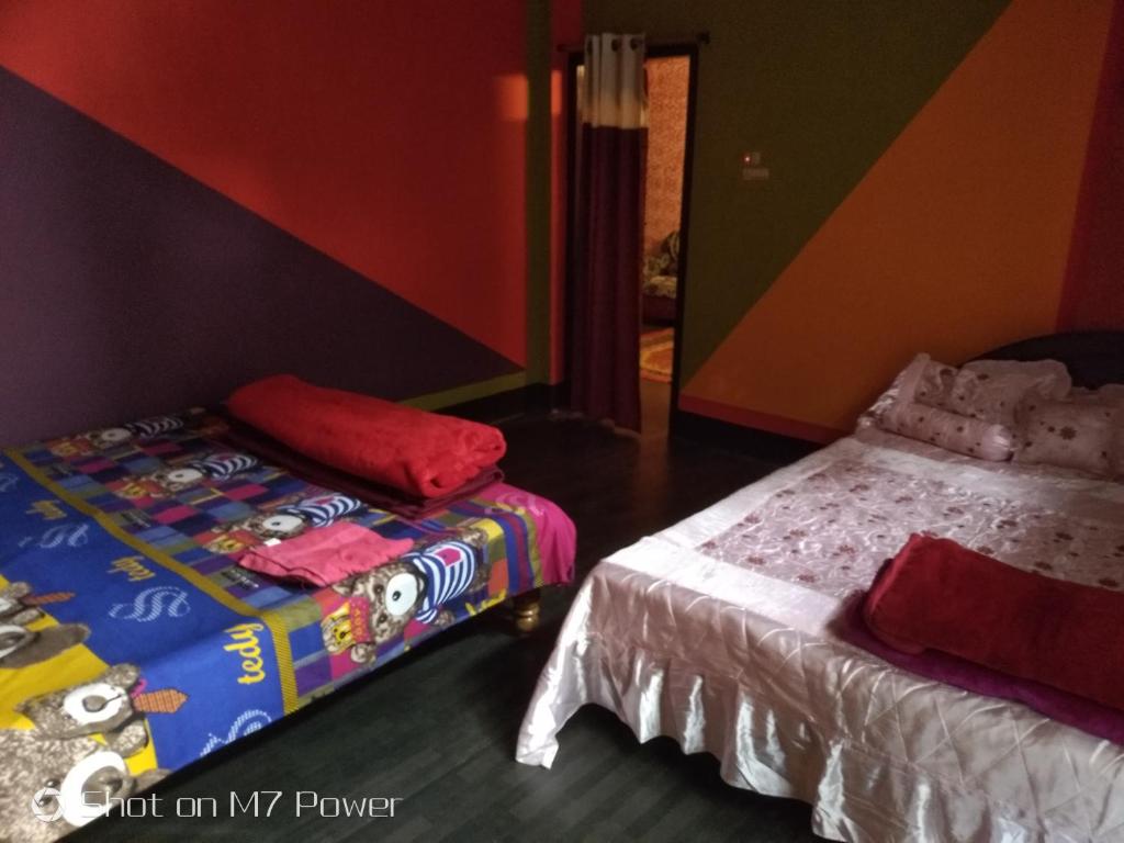 Dekapara Airport Guest House客房内的一张或多张床位