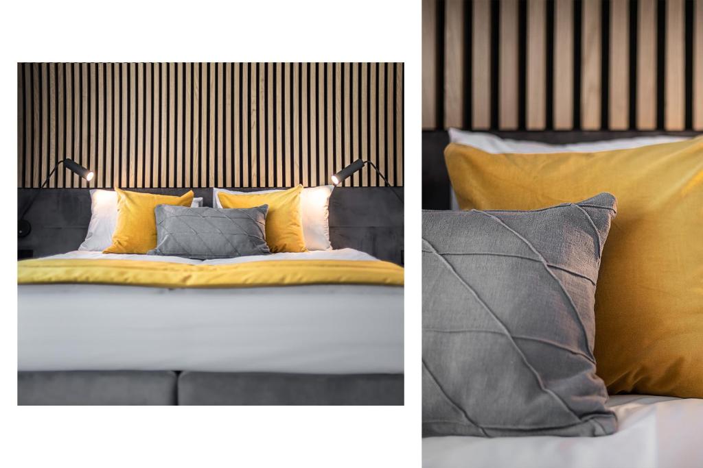 克莱佩达Jono kalnelis Apartments的两张带黄色和灰色枕头的床照片