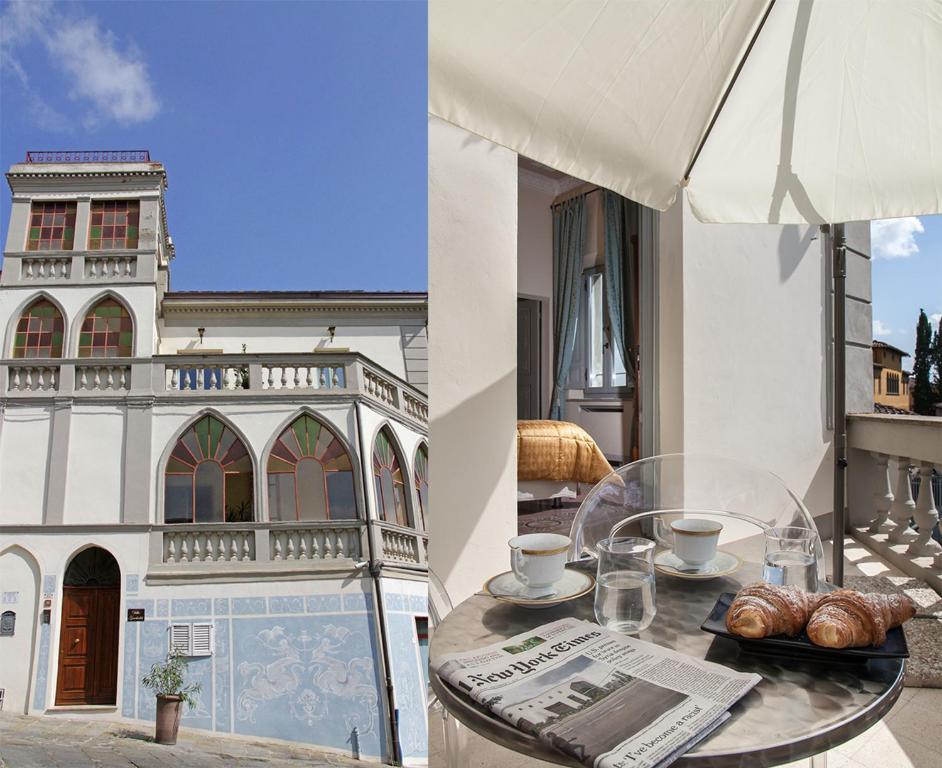贝托勒Villa Garibaldi的一张带羊角面包的桌子和一个阳台上的一座建筑