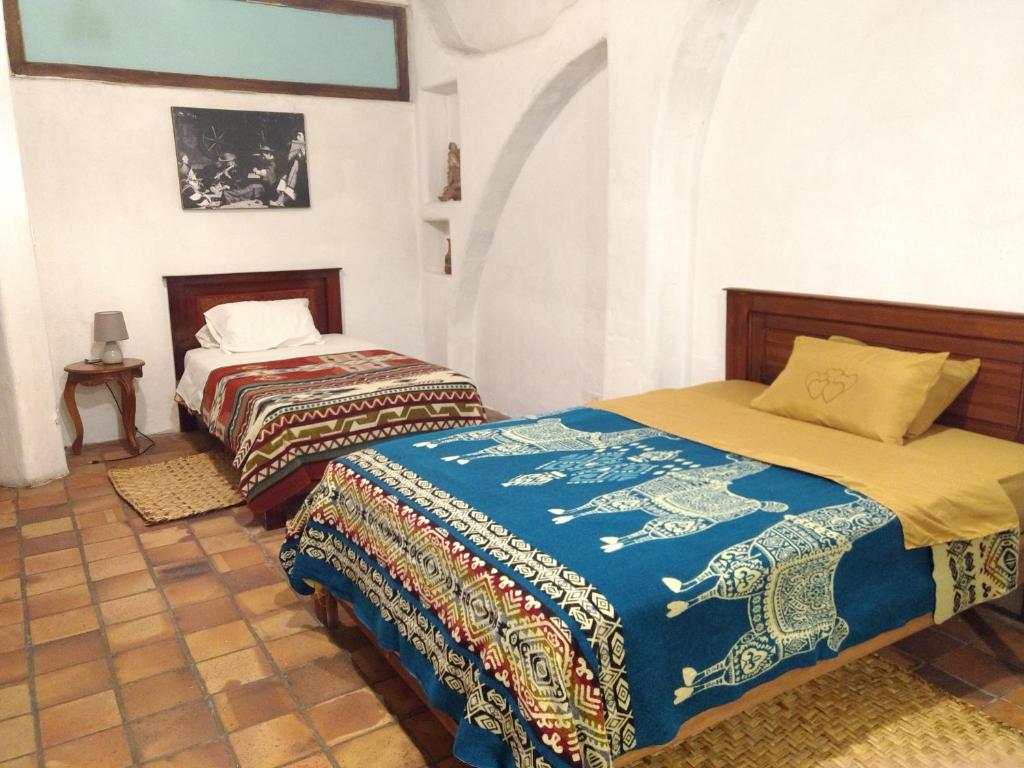 Aylluwasi Guesthouse客房内的一张或多张床位