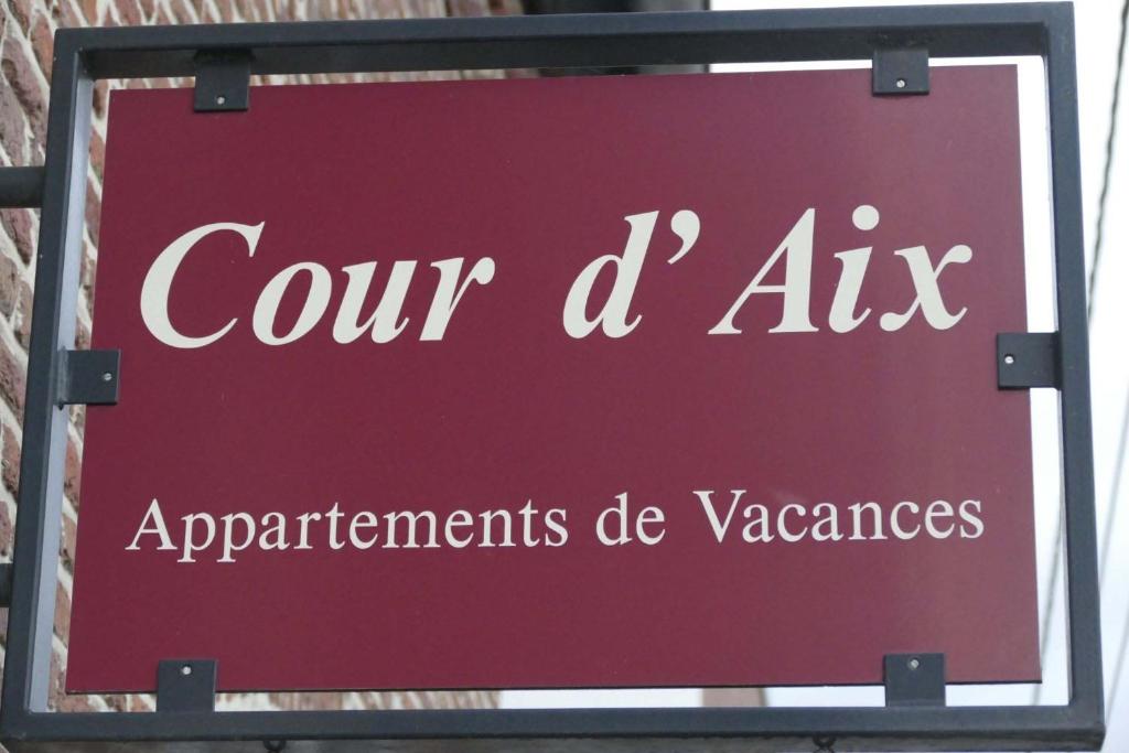 RichelleApartments Cour d'Aix的红色的标志,读我们的九家电器部门