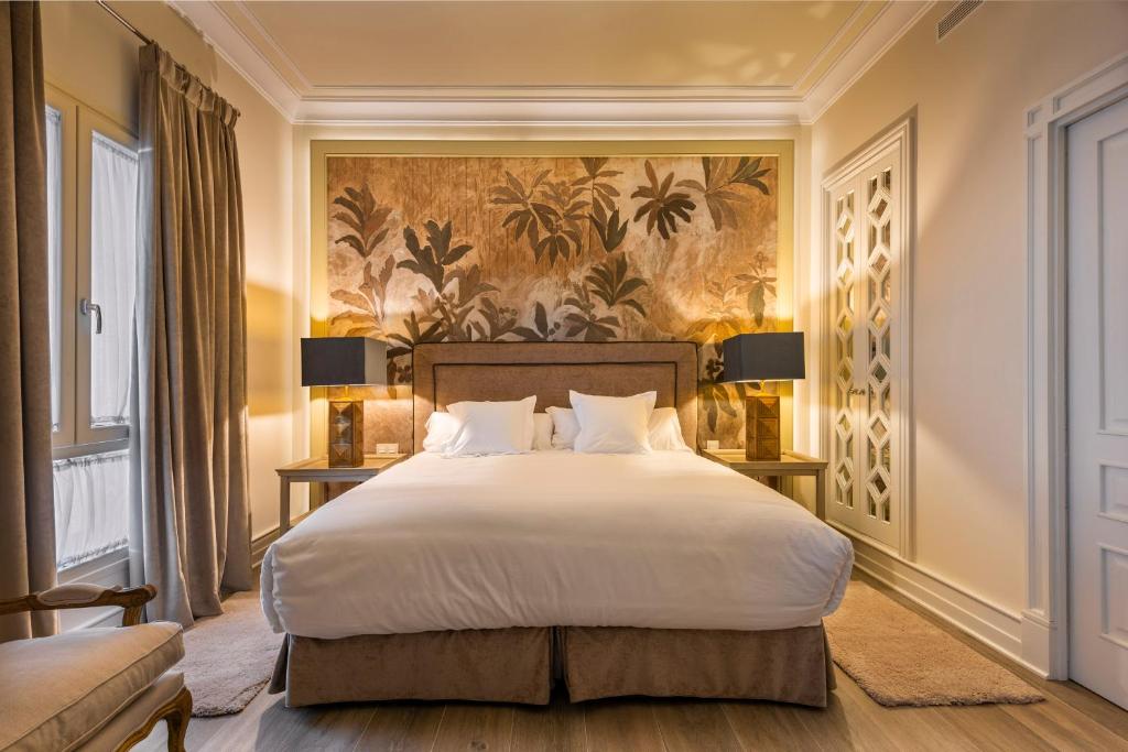 Casa de Triana Luxury Suites by Casa del Poeta客房内的一张或多张床位