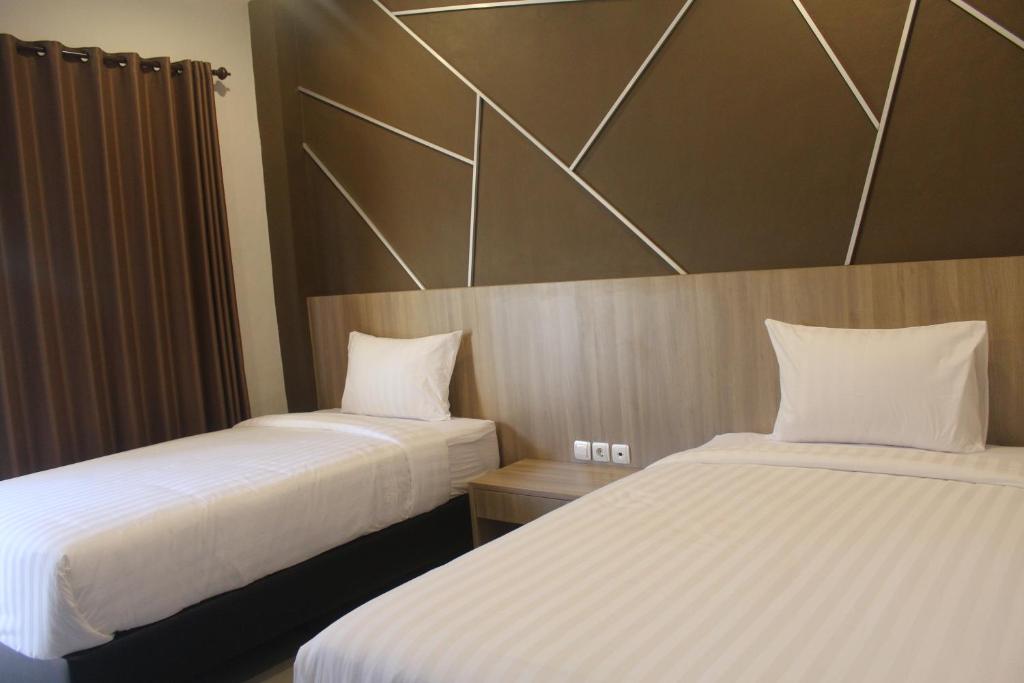 Grand Kuta Hotel客房内的一张或多张床位
