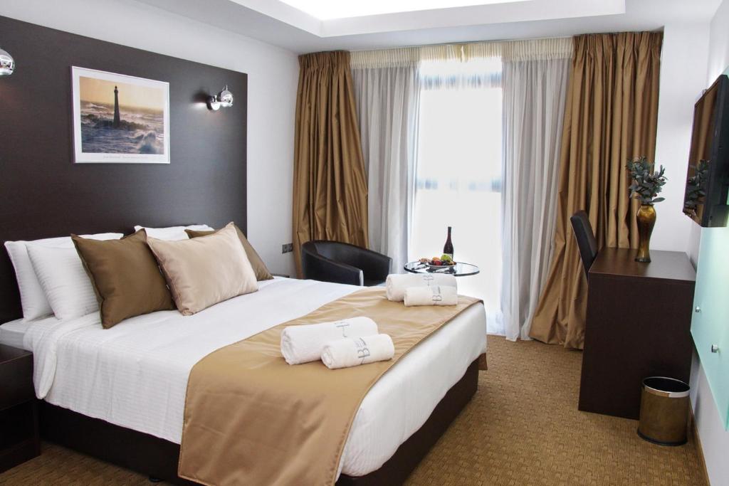 雅典微风精品酒店客房内的一张或多张床位