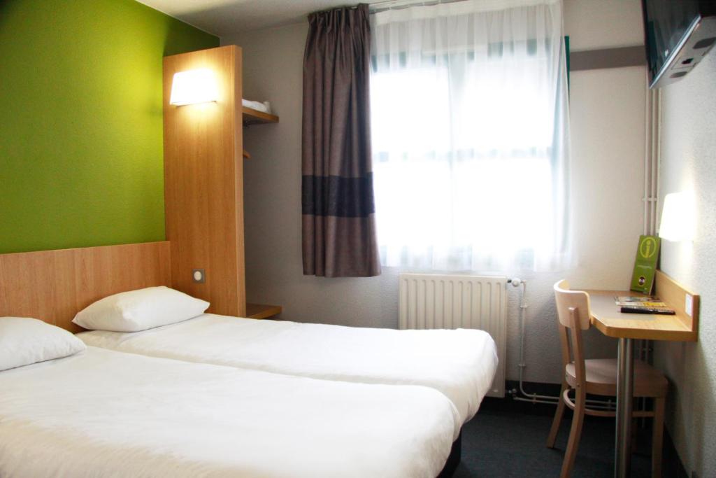 Hotel Inn design Vierzon - ex B&B客房内的一张或多张床位
