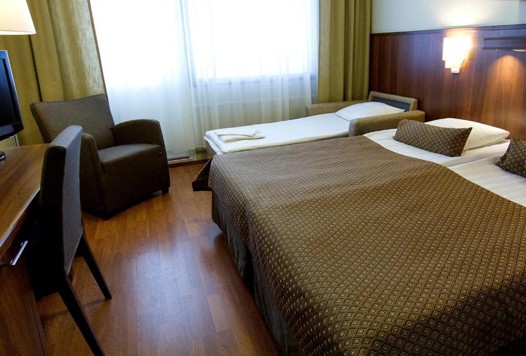 劳哈拉赫蒂Spa酒店客房内的一张或多张床位