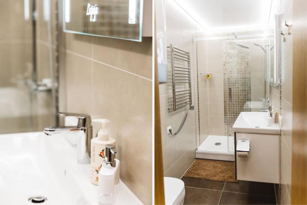 利耶帕亚Brand-New Deluxe Apartment in Liepāja的带淋浴、卫生间和盥洗盆的浴室