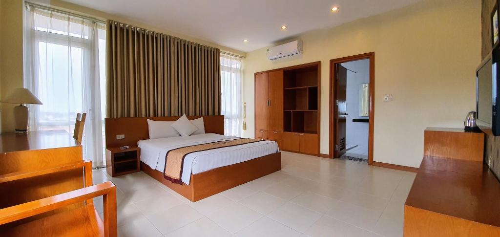 The Queen Hotel Ninh Binh客房内的一张或多张床位