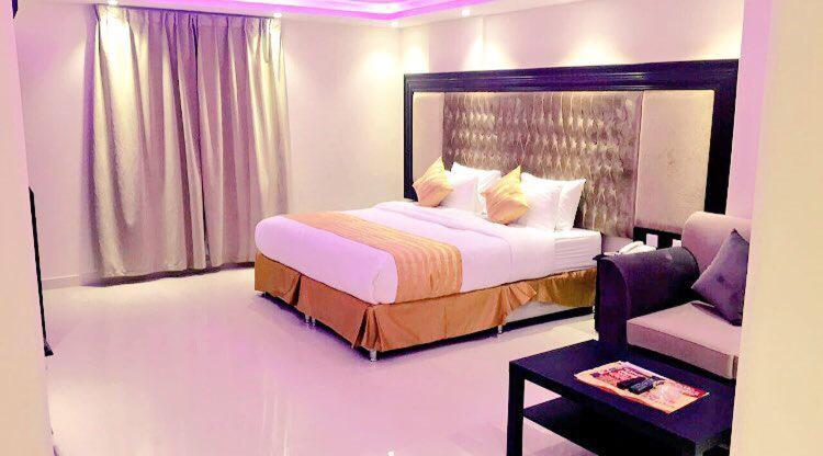 Al Sharq Hotel客房内的一张或多张床位
