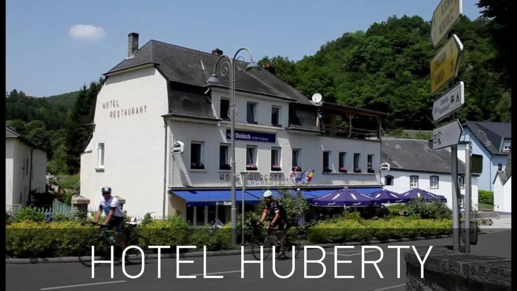 考滕巴赫Hotel Huberty Kautenbach的前面有标志的酒店