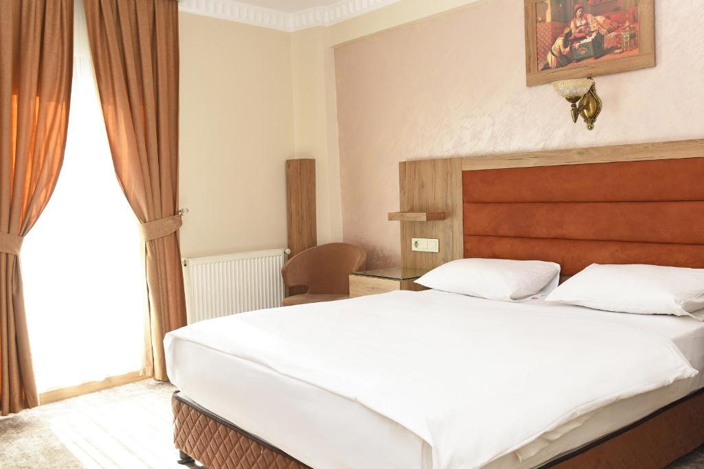 格兰特乌米特酒店客房内的一张或多张床位