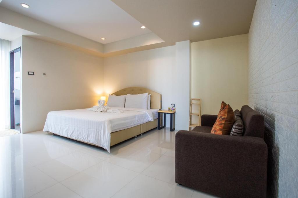 Le Neuf Nakorn Lampang客房内的一张或多张床位