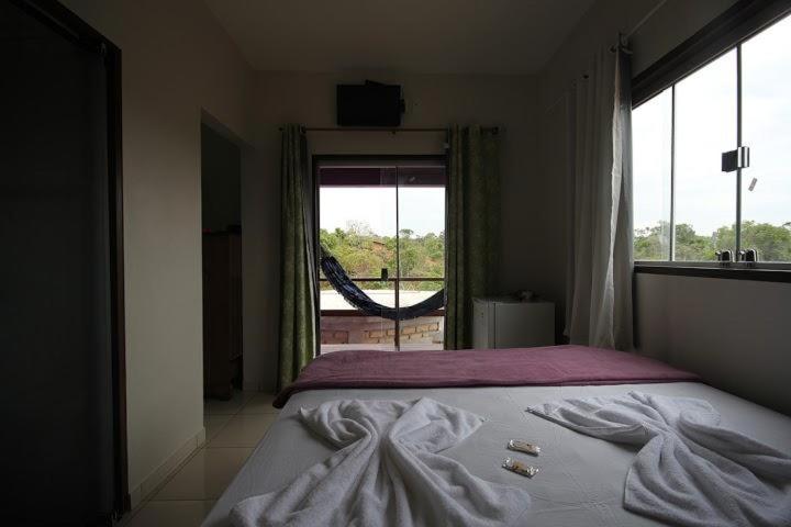 Flat da Pousada Avalon (Bolinha)客房内的一张或多张床位