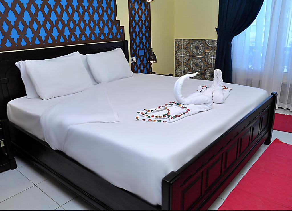 New Star Zamalek Hotel客房内的一张或多张床位