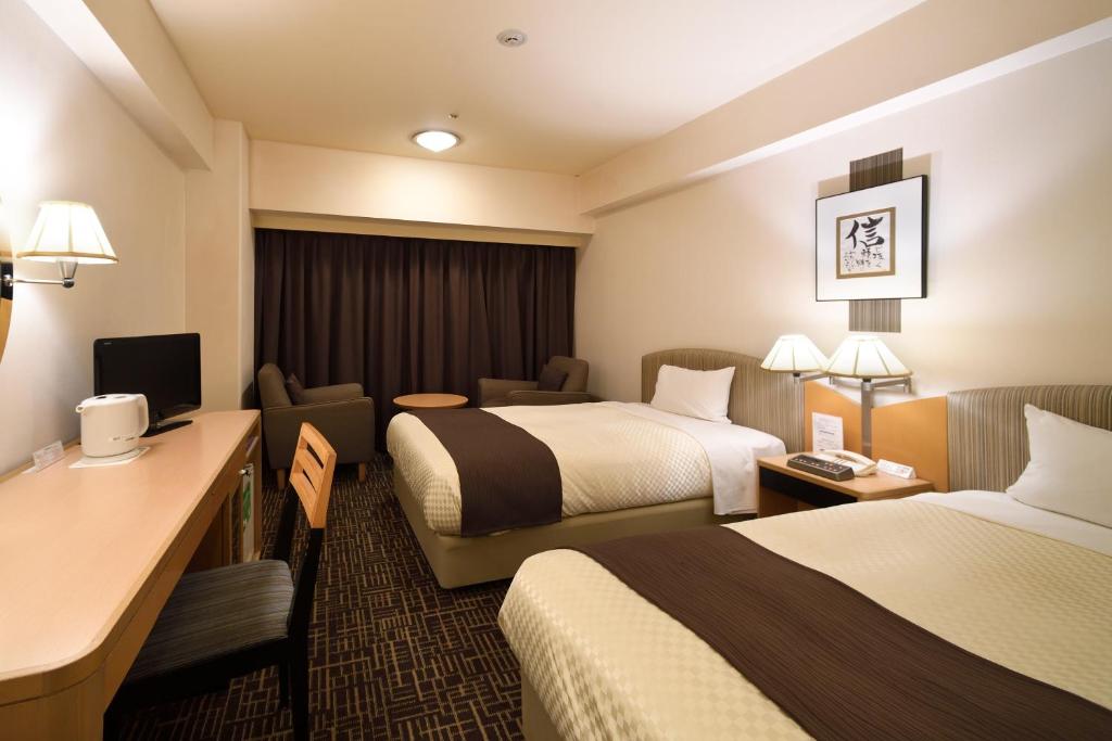 福冈运河城华盛顿酒店客房内的一张或多张床位