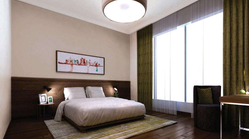 多哈多哈萨默塞特西湾公寓式酒店的一间卧室设有一张床和一个大窗户