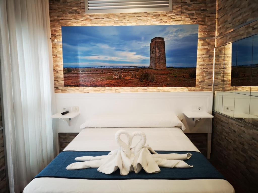 科尼尔-德拉弗龙特拉科斯塔鲁斯旅馆的卧室配有2条毛巾。