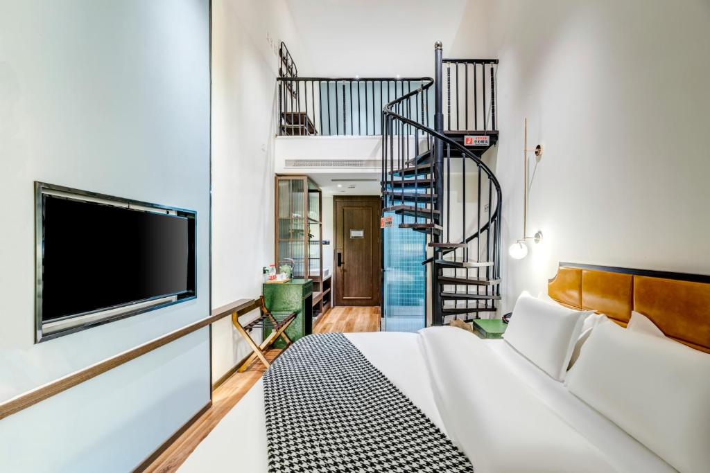 Happy Dragon City Culture Hotel-Tianjin Draum Tower &amp; Dayuecheng shopping mall客房内的一张或多张床位