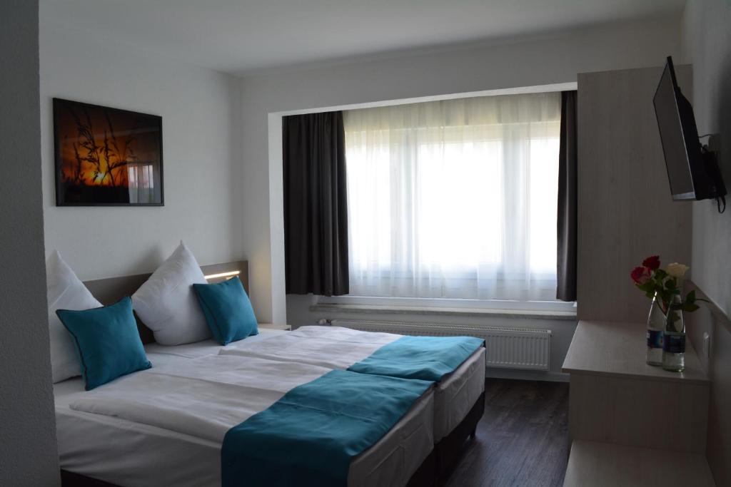 Hotel BaWü客房内的一张或多张床位