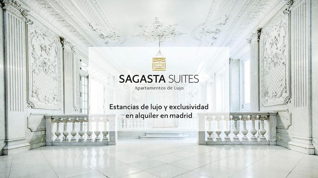 马德里Sagasta Suites Luxury Apartments的白色房间 ⁇ 染,上面有标志