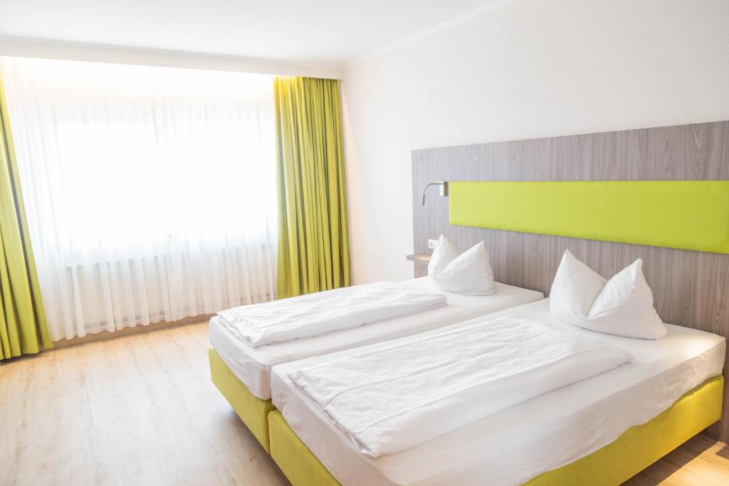 Das Ebertor - Hotel & Hostel客房内的一张或多张床位