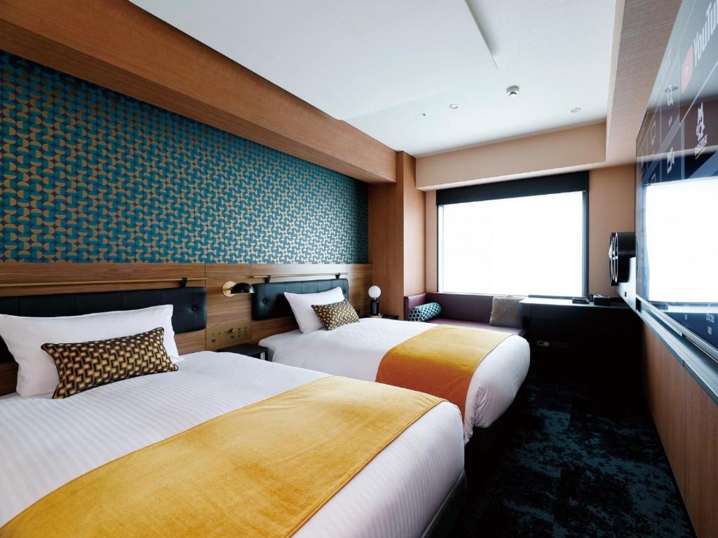 DEL style Osaka Shin Umeda by Daiwa Roynet Hotel客房内的一张或多张床位