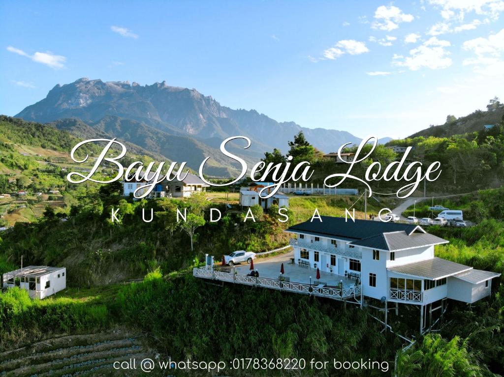 昆达桑Bayu Senja Lodge的山中巴胡萨瓦亚小屋的标志