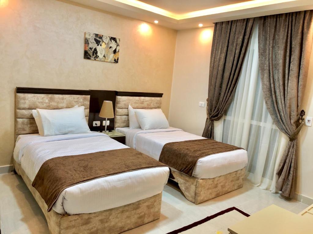 Jewel Dokki Hotel客房内的一张或多张床位