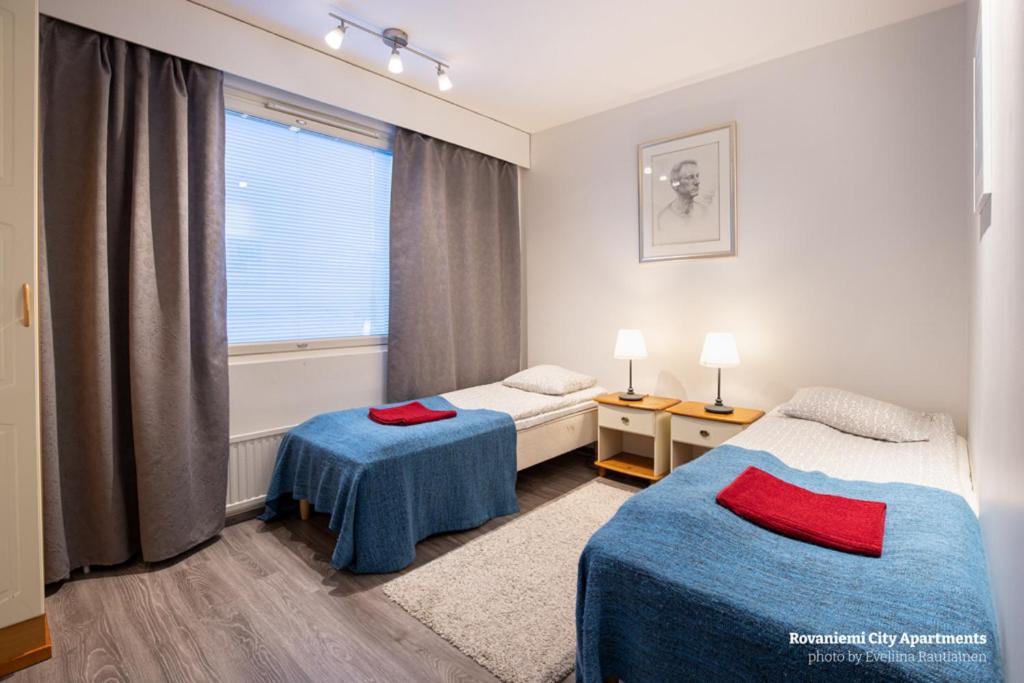 罗瓦涅米城市公寓客房内的一张或多张床位