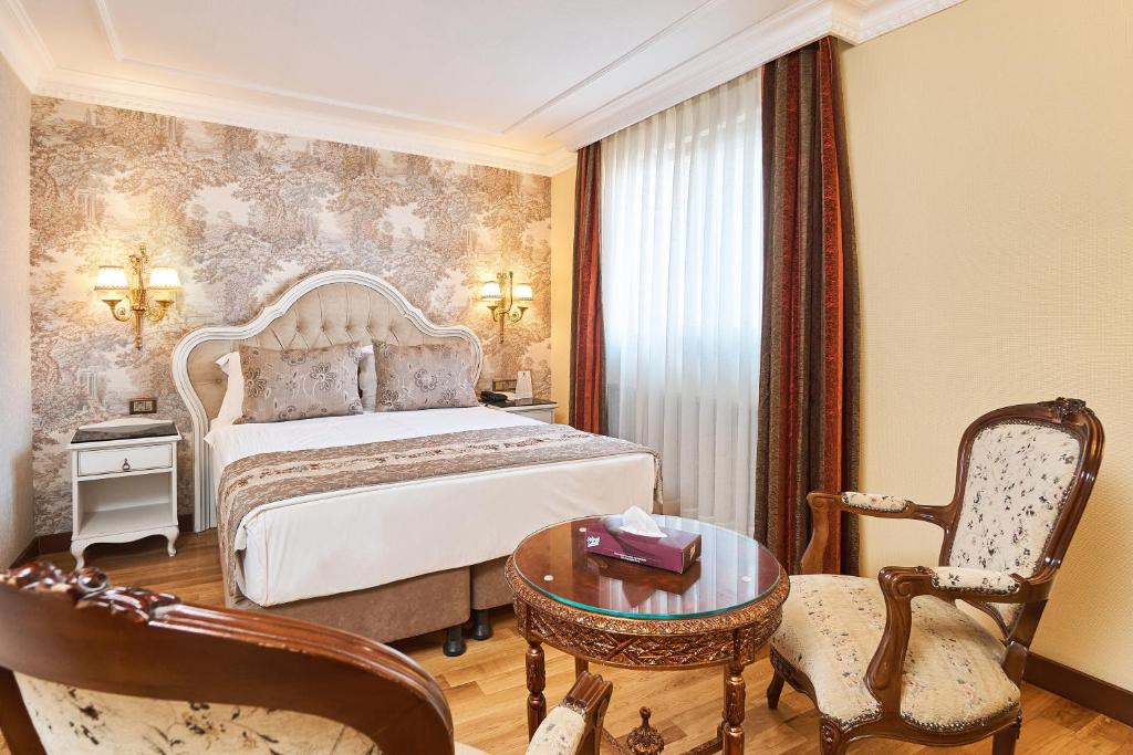 最佳西方帝国皇宫酒店及spa中心客房内的一张或多张床位