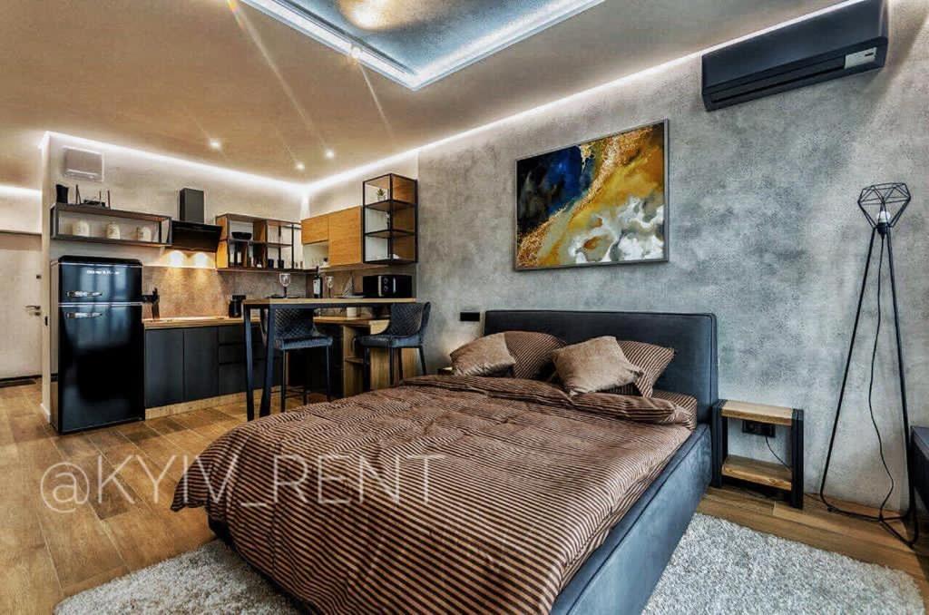 基辅Modern VIP Smart.的一间卧室配有一张床和一间厨房