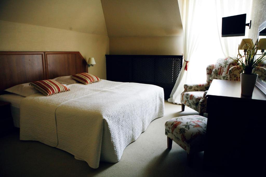 佐扎酒店客房内的一张或多张床位