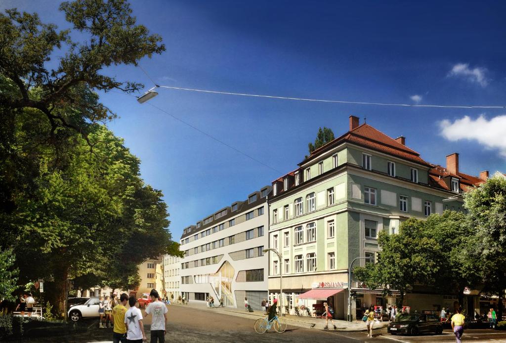 慕尼黑Jugendherberge München City的风筝在建筑物上空飞翔