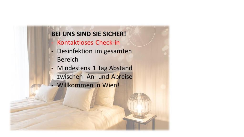 维也纳vienna westside apartments - contactless check-in的一间卧室,配有一张带字幕墙的床