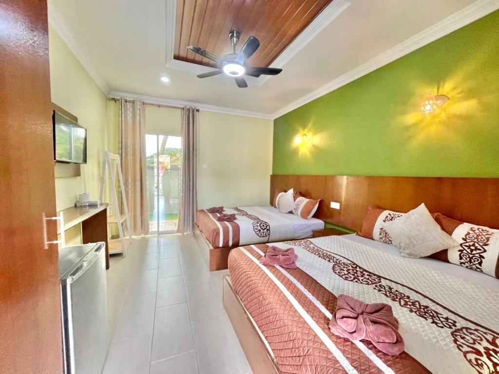 Norshah Village Resort客房内的一张或多张床位
